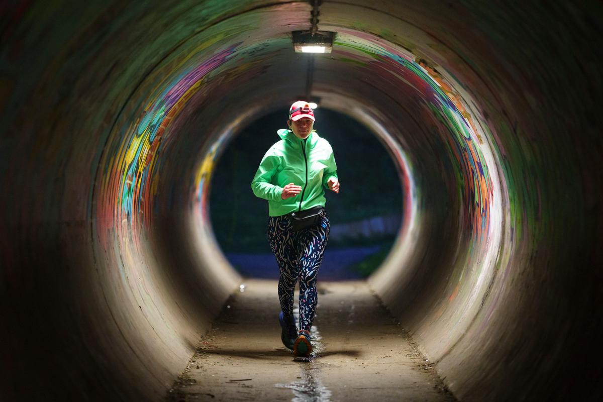 Ms. Ryvar runs through an underpass in Wrexham during a half marathon. (Jon Super/AP Photo)