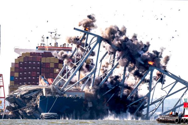 Crews conduct a controlled demolition of a section of the Francis Scott Key Bridge resting on the Dali container ship in Baltimore, Md., on May 13, 2024. (Roberto Schmidt/AFP via Getty Images)