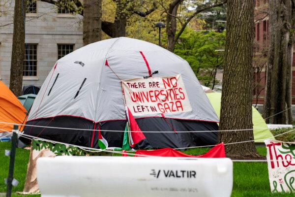 Tents and signs fill Harvard Yard by the John Harvard statue in the Pro-Palestinian encampment at Harvard University in Cambridge, Massachusetts, on May 5, 2024. (Joseph Prezioso/AFP)