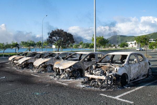 A photo shows burnt-out cars in the parking lot of the old hospital on the outskirts of Noumea, New Caledonia in the South Pacific on May 16, 2024. (Delphine Mayeur /AFP via Getty Images)