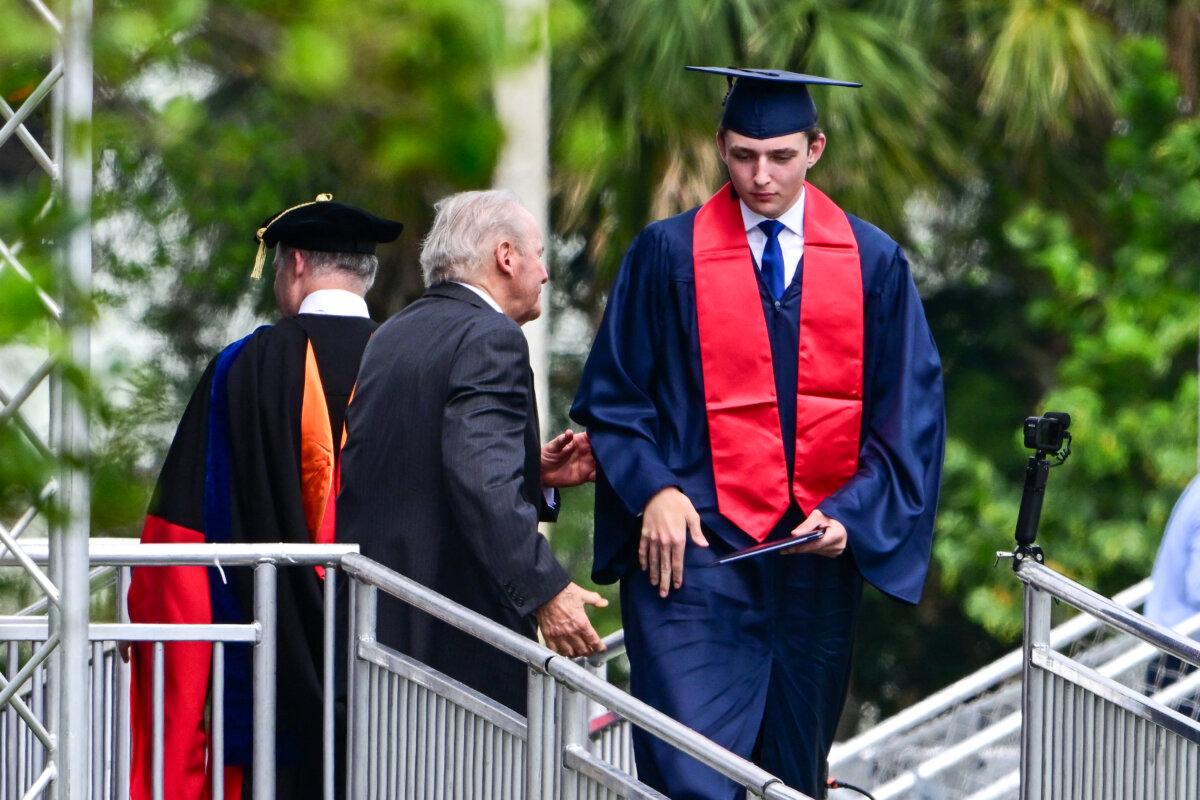 Barron Trump, son of former President Donald Trump and former First Lady Melania Trump, takes part in his graduation at Oxbridge Academy in Palm Beach, Fla., on May 17, 2024. (Giorgio Viera/AFP via Getty Images)