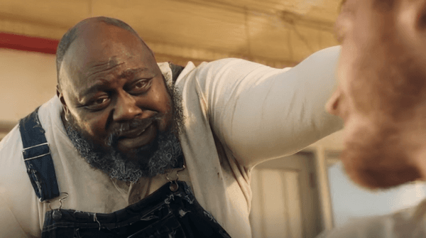 Vernon, the gas station owner (Faizon Love, L) informs bank robber Travis (Nicholas Logan) that the pumps are dry, in "The Last Stop in Yuma County." (Well Go USA Entertainment)