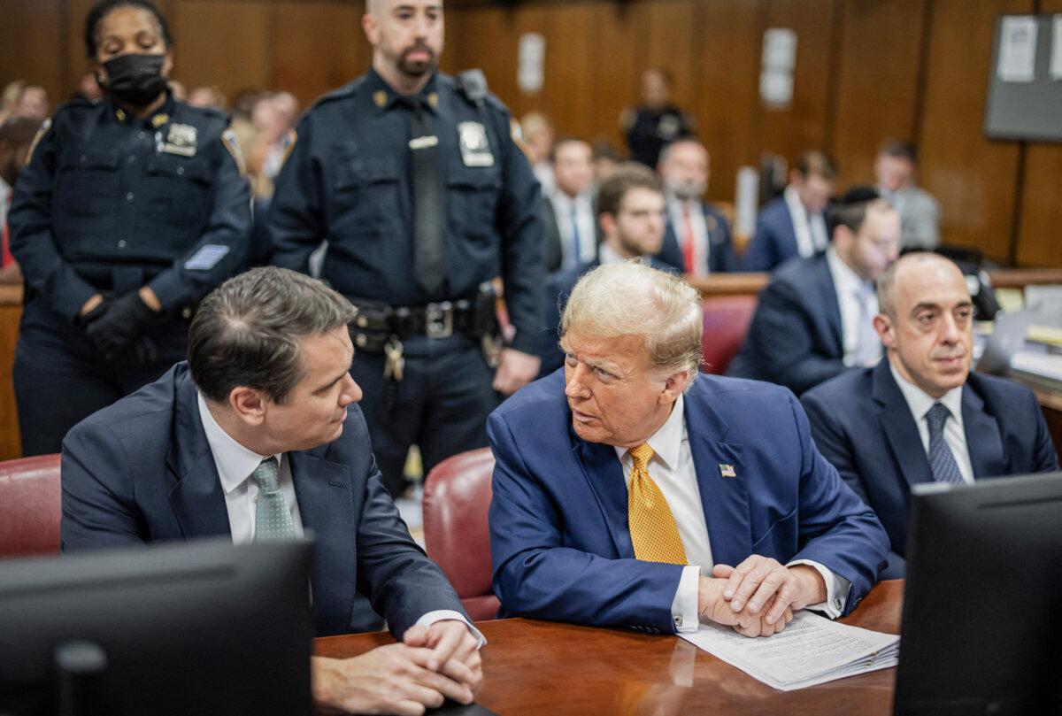 Former President Donald Trump and his lawyers Todd Blanche (L) and Emil Bove (R), in the courtroom at Manhattan Criminal Court in New York City on May 14, 2024. (Justin Lane/POOL/AFP via Getty Images)