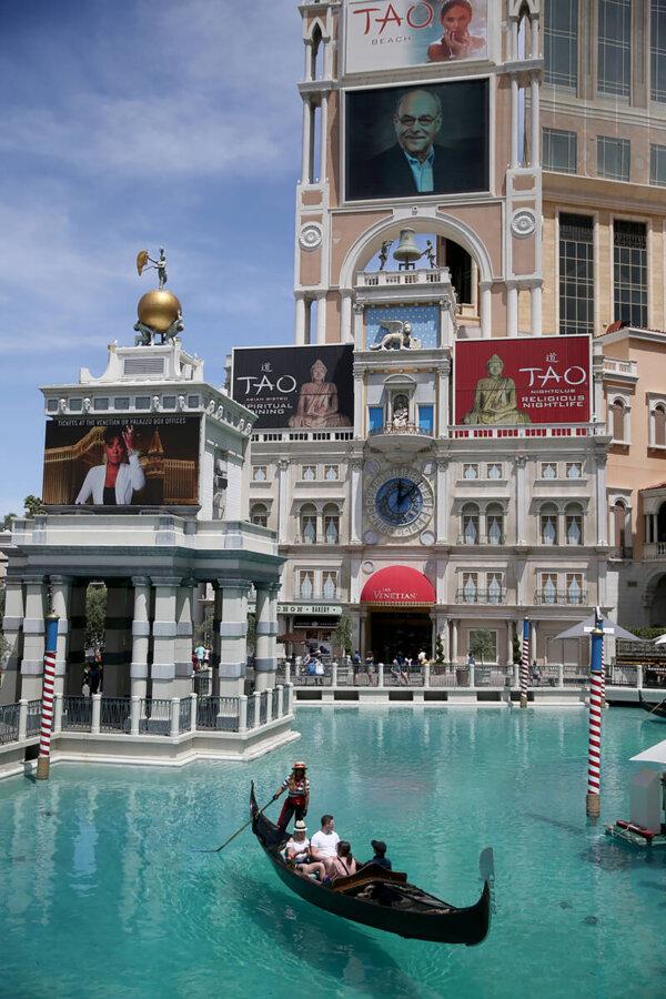 Portraits of founding employees are displayed on The Venetian marquee to celebrate the 20th anniversary of Las Vegas Strip resort May 3, 2019. (K.M. Cannon/Las Vegas Review-Journal/TNS)