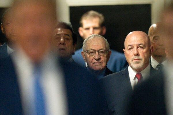 Attorney Alan Dershowitz and Former New York City Police Commissioner Bernard Kerik listen as former President Donald Trump speaks to the media after arriving for court during his trial on May 20, 2024 in New York City. (Steven Hirsch-Pool/Getty Images)