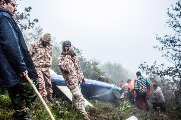 Rescue team members work at the site of a crashed helicopter, an incident in which Iranian President Ebrahim Raisi was killed, in Varzaghan, northwestern Iran, on May 20, 2024. (Azin Haghighi/AFP via Getty Images)