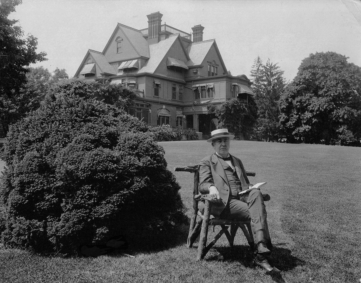 Thomas Edison reading on his lawn at Glenmont, June 30, 1917. National Park Services. (Public Domain)