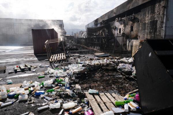 Bottles and debris are seen scattered on the gound in the Normandy industrial zone in Noumea, New Caledonia, on May 20, 2024. (Theo Rouby/AFP via Getty Images)