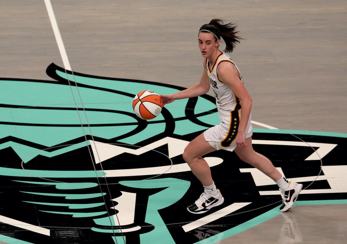Caitlin Clark, #22 of the Indiana Fever, takes the ball during the second half against the New York Liberty at Barclays Center in New York City on May 18, 2024. (Elsa/Getty Images)