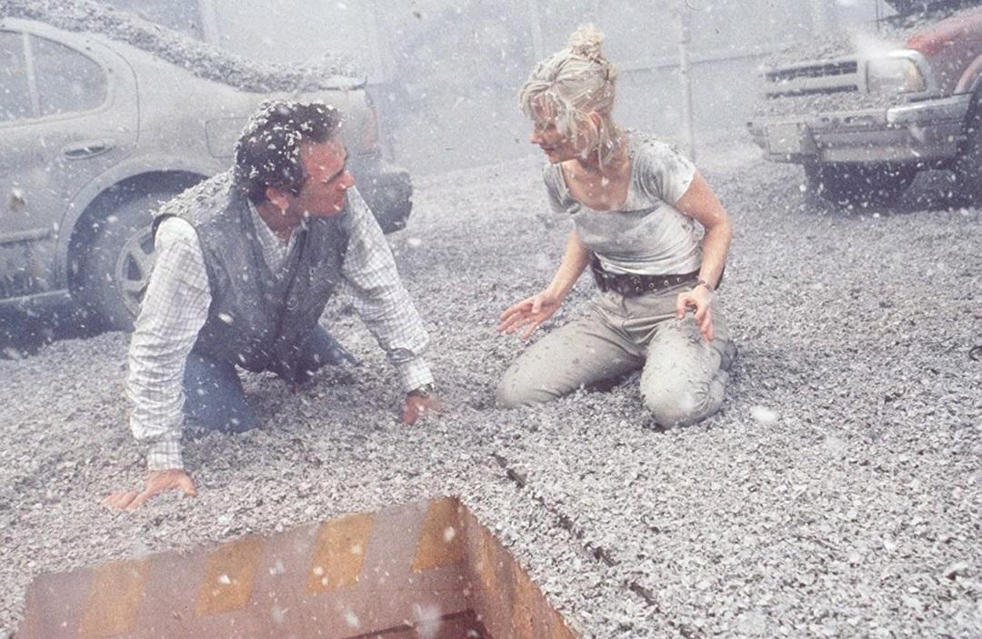 Mike Roark (Tommy Lee Jones) and seismologist Dr. Amy Barnes (Anne Heche) battle a volcano, in "Volcano." (20th Century Fox)