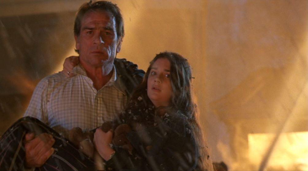 Mike Roark (Tommy Lee Jones) saves Anita (Susie Essman), in "Volcano." (20th century Fox)