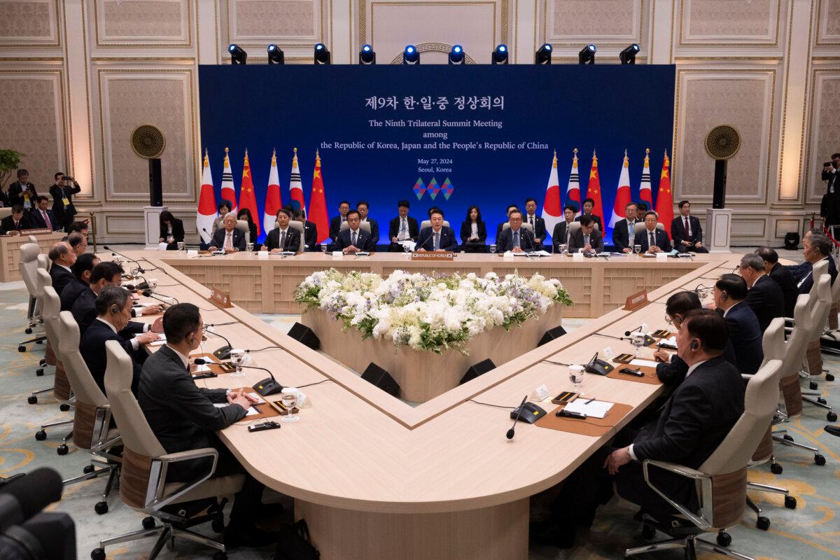 (L-R) Japanese Prime Minister Fumio Kishida, South Korean President Yoon Suk Yeol and Chinese Premier Li Qiang and their respective delegations attend a trilateral summit in Seoul, South Korea on May 27, 2024. (by Jeon Heon-kyun-Pool/Getty Images)