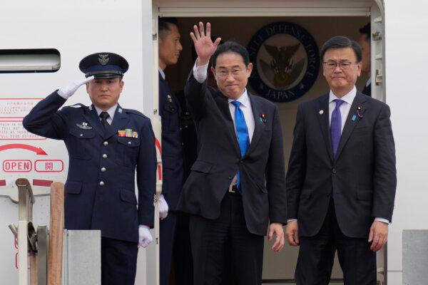 Japanese Prime Minister Fumio Kishida (C) waves as he boards the plane to leave after attending the trilateral meeting with South Korean President Yoon Suk Yeol and Chinese Premier Li Qiang, at the Seoul airport in Seongnam, South Korea, on May 27, 2024. (AP Photo/Lee Jin-man)