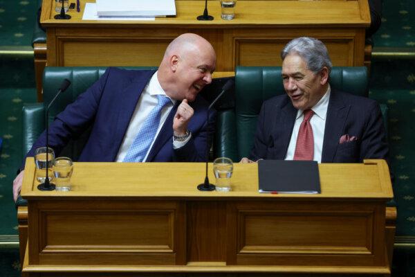 Prime Minister Christopher Luxon speaks to Deputy Prime Minister and NZ First Leader Winston Peters during budget day 2024 at Parliament in Wellington, New Zealand, on May 30, 2024. (Hagen Hopkins/Getty Images)