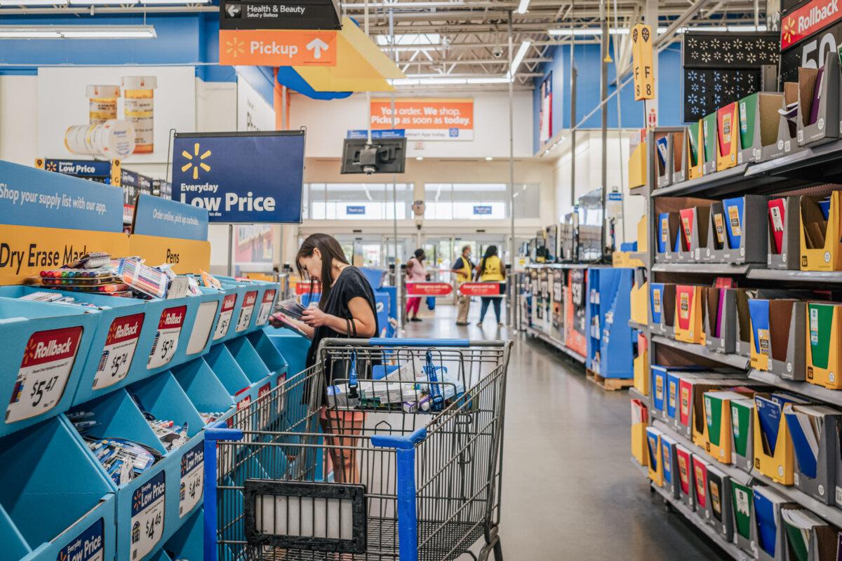 Customer Shop (Brandon Bell/Getty Images) at Walmart store in Houston on August 4, 2021