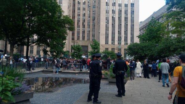 Supporters and bitter foes of President Trump milled about in the park outside 100 Centre St. under a heavy police and court officer presence after a guilty verdict was returned May 30, 2024. (Michael Washburn/The Epoch Times)