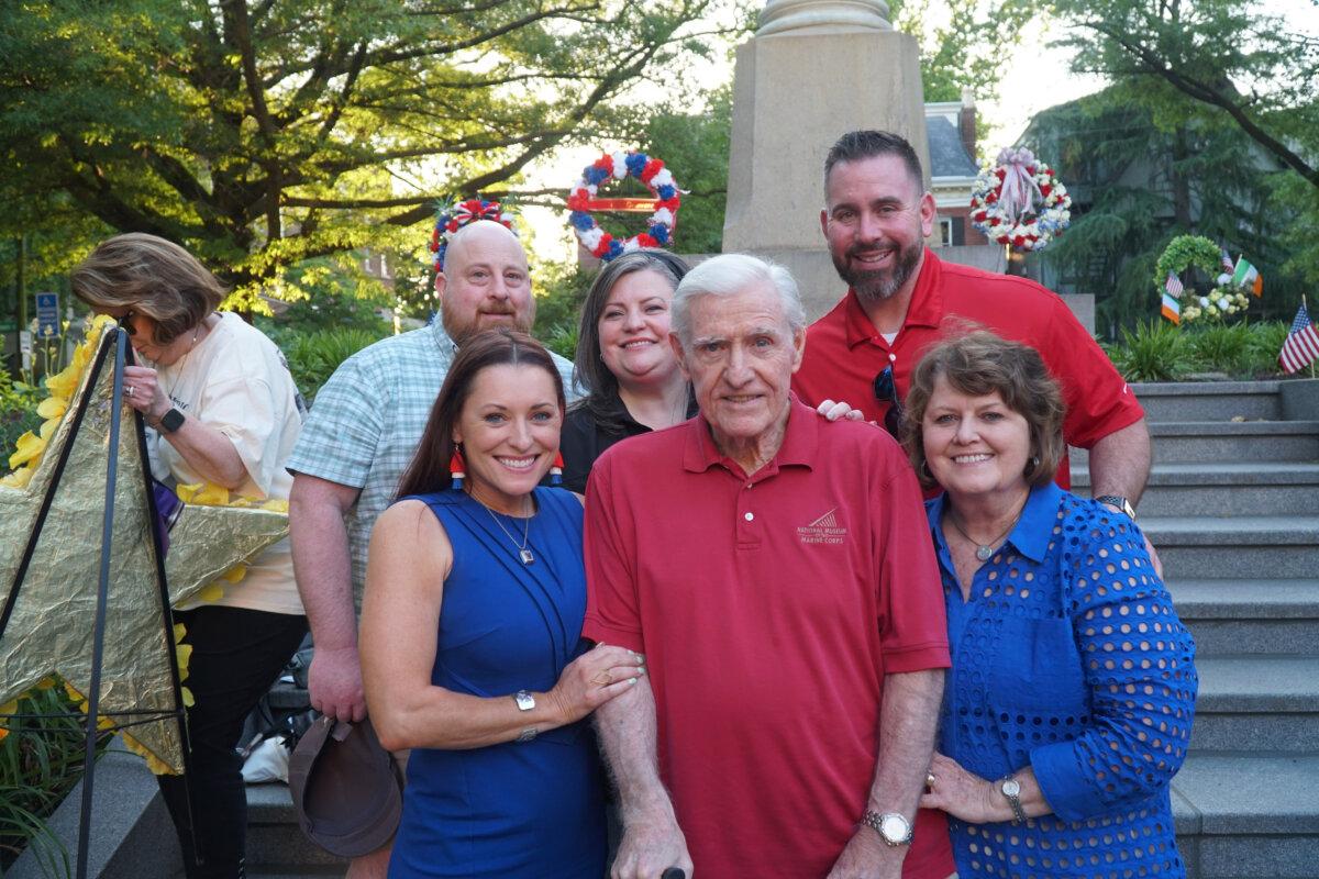 U.S. Marine Corps Captain James Thornton, an 80-year-old veteran of the Vietnam War, standing alongside his wife of 55 years, Kathy, and other family members, at the Wilmington Memorial Day ceremony, May 30, 2024. (Lily Sun/The Epoch Times)