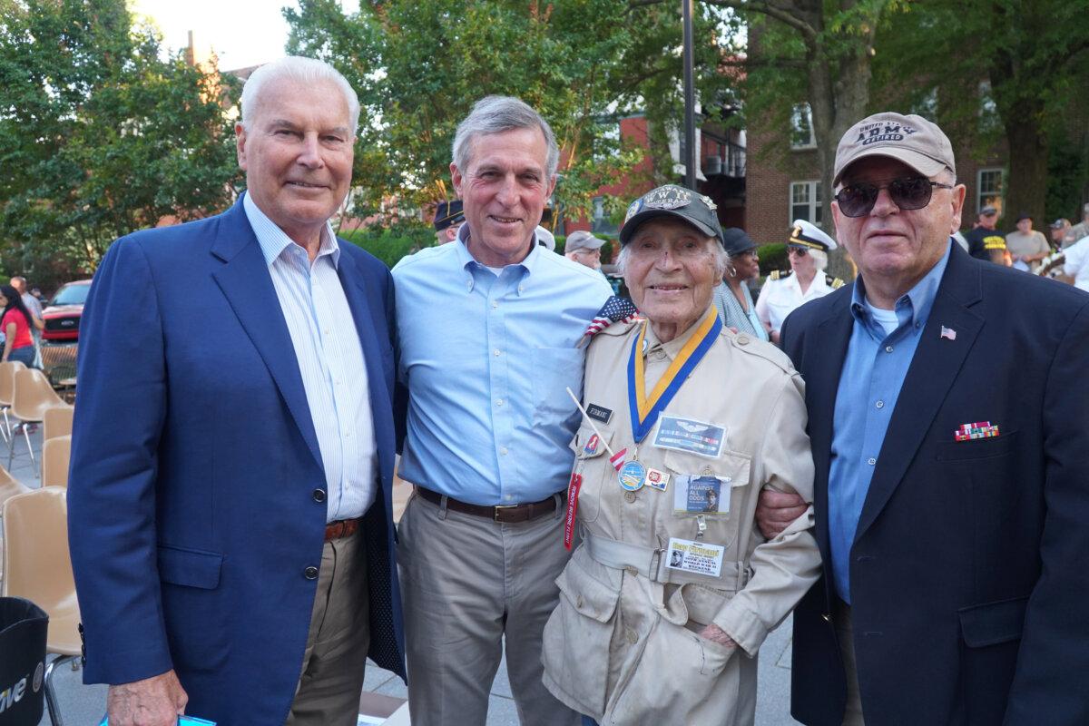 The 157th Wilmington Memorial Day ceremony was held on May 30, 2024. From left: Wilmington Mayor Mike Purzycki, Delaware Gov. John Carney, 102-year-old World War II veteran Ray Firmani. (Lily Sun/The Epoch Times)