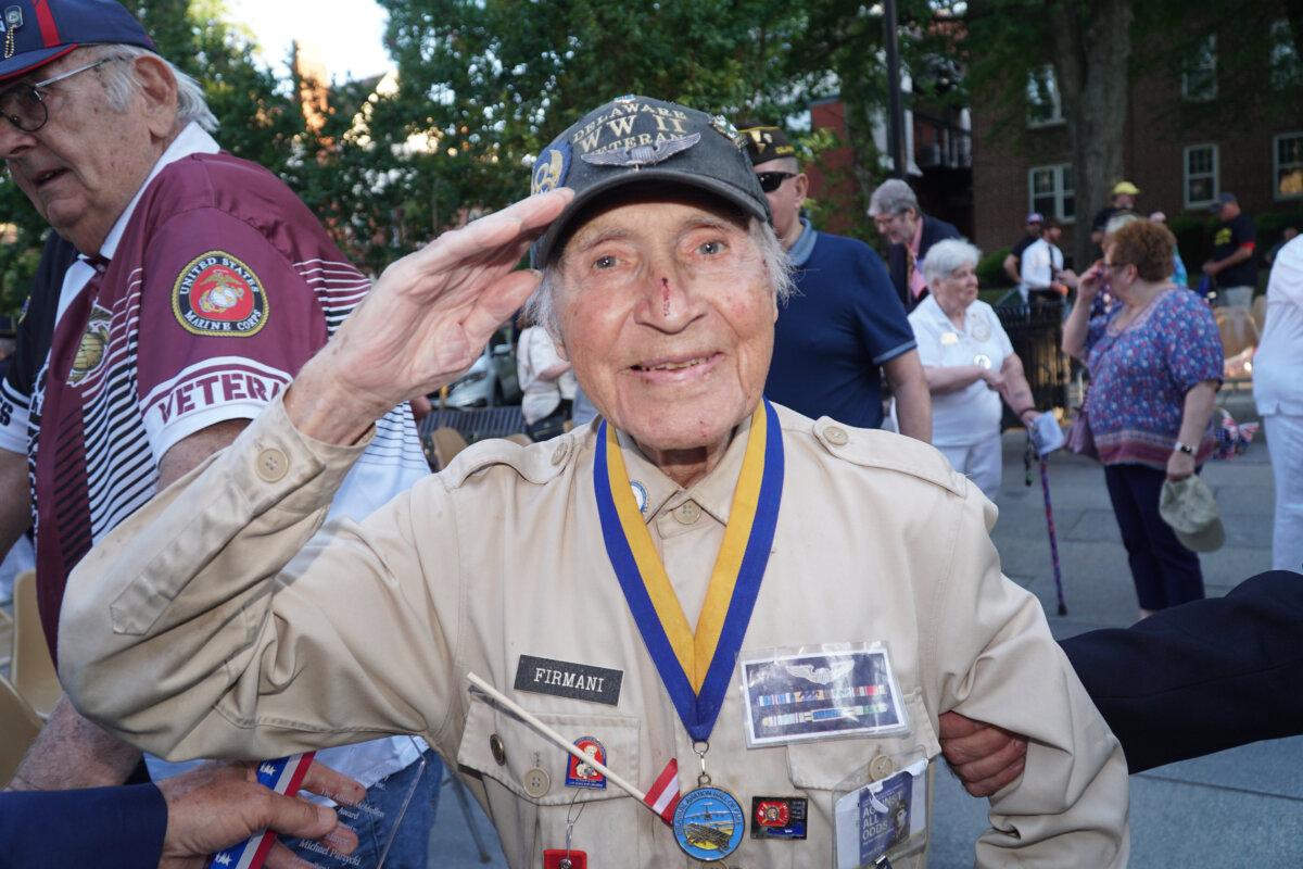 Ray Firmani, a 102-year-old World War II veteran said at the 2024 Wilmington Memorial Day ceremony, “It's a time to remember that certain people made sacrifice, the ultimate sacrifice, and be thankful for them.” A book “Against All Odds: The Ray Firmani Story” has been written about his life. (Lily Sun/The Epoch Times)