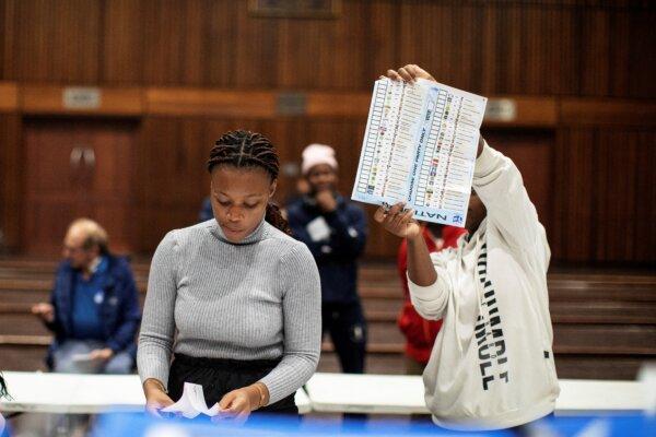 An Electoral Commission of South Africa official holds up a marked ballot during the vote-counting process at the Norwood school polling station in Durban, South Africa, on May 29, 2024, during South Africa's general election. (Gianluigi Guercia/AFP via Getty Images)