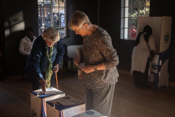 Women cast their votes at a polling station in Auckland Park on May 29, 2024, in Johannesburg. (Chris McGrath/Getty Images)