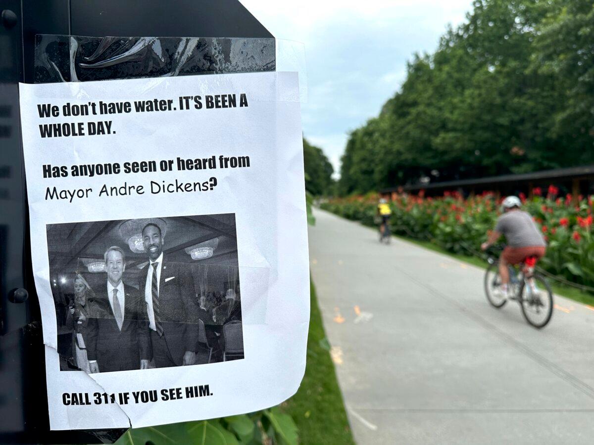 A sign expressing frustration with the city of Atlanta's response after corroding water pipes causing interruptions in water service to homes and businesses are seen along the Beltline trail in the city's Reynoldstown neighborhood on June 1, 2024. (Kate Brumback/AP Photo)