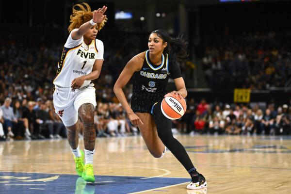 Angel Reese #5 of the Chicago Sky drives with the basketball in the first half against NaLyssa Smith #1 of the Indiana Fever at Wintrust Arena in Chicago, Ill., on June 23, 2024. (Quinn Harris/Getty Images)