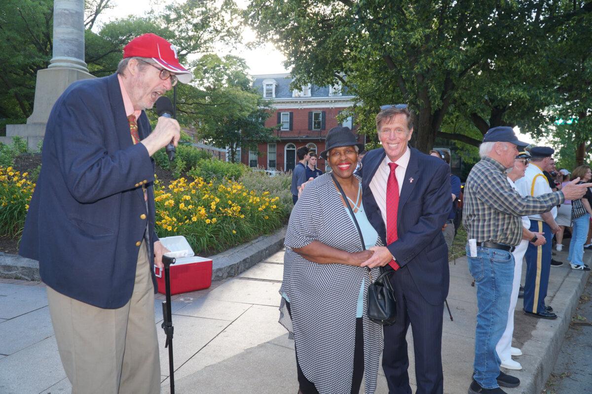 John Flaherty (left), Executive Director of Wilmington Memorial Day Committee introduced parade participants at the 157th Wilmington Memorial Day Parade, May 30, 2024. State Rep. Michael Ramone (middle) joined the parade. (Lily Sun/The Epoch Times)