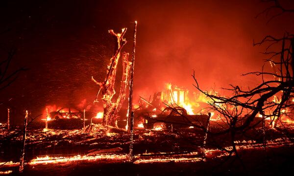 A home burns during the Corral Fire at Bernard and Stearman roads, west of Tracy, Calif., on June 1, 2024. (Kent Porter/The Press Democrat via AP)