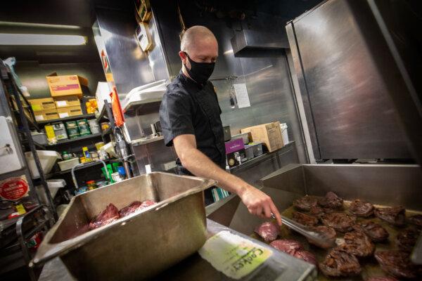 Staff at La Camera restaurant in Southgate prepare food in Melbourne, Australia, on Oct. 27, 2020. (Darrian Traynor/Getty Images)