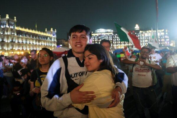 Supporters of ruling party presidential candidate Claudia Sheinbaum embrace after the polls closed during general elections at the Zocalo, Mexico City's main square on June 2, 2024. (Ginnette Riquelme/AP Photo)