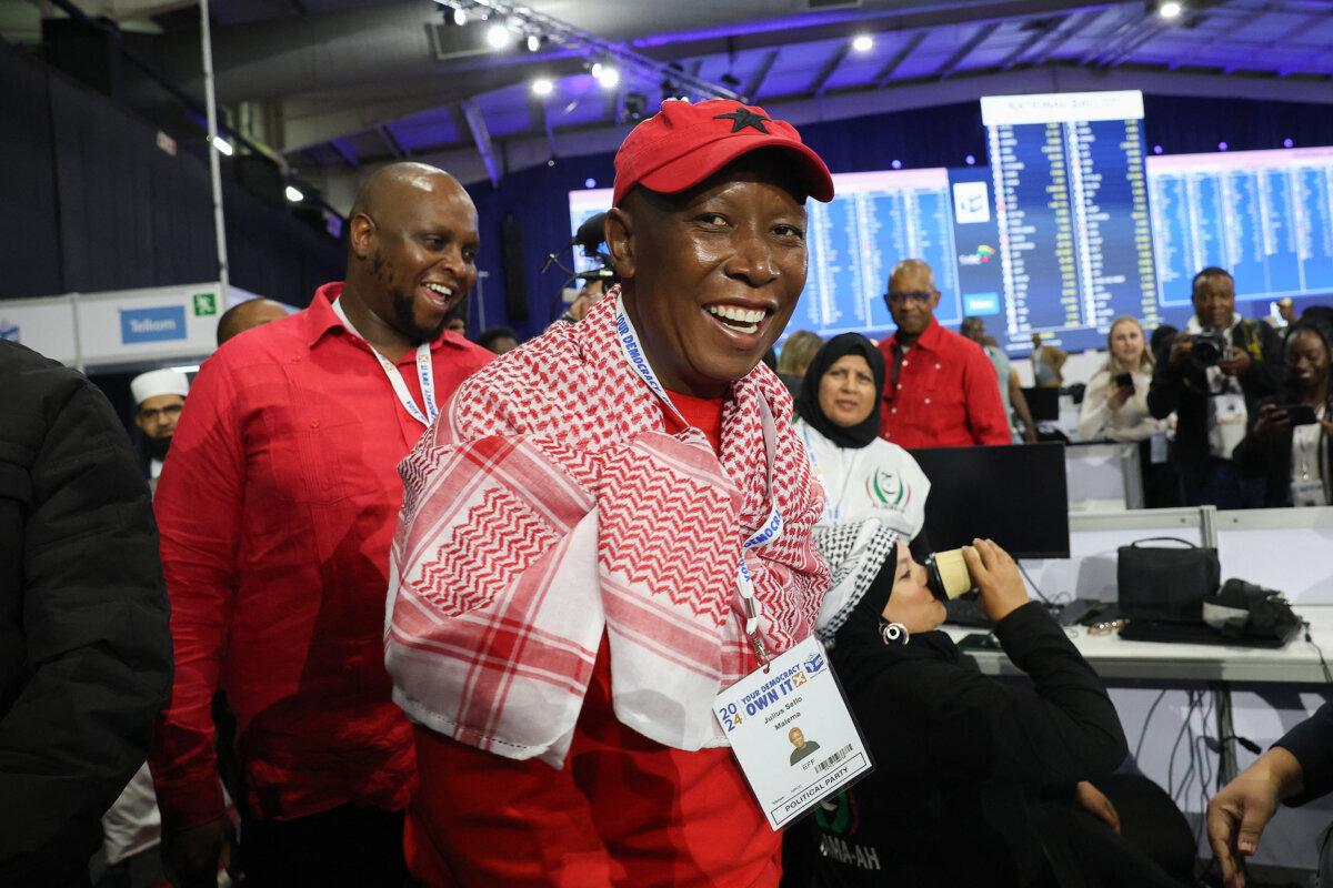 Economic Freedom Fighters leader Julius Malema (R) reacts as he arrives at the Independent Electoral Commission National Results Center on June 1, 2024. (Phill Magakoe/AFP via Getty Images)