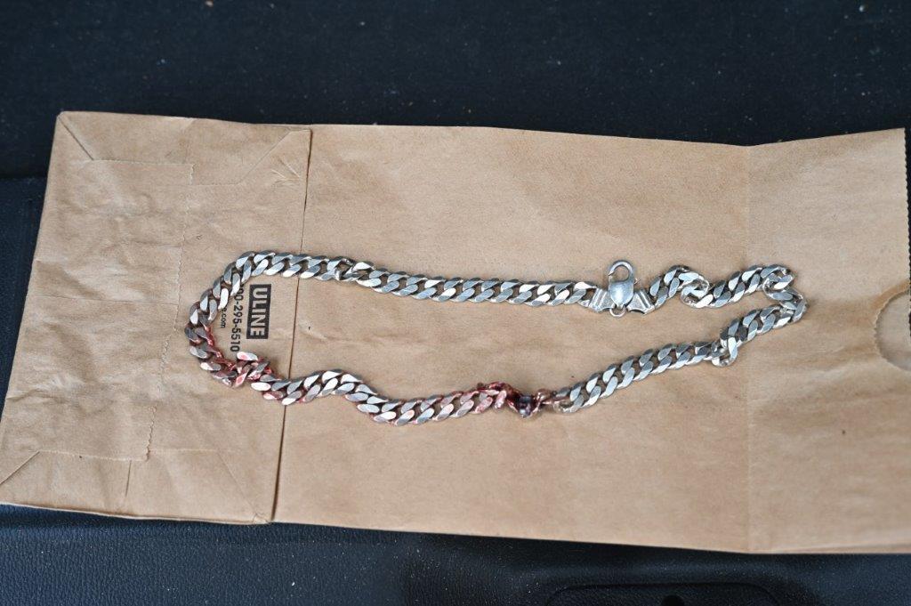 Commerce City Police posted photos of the chain with a bullet lodged in it on Facebook. (Courtesy of Commerce City Police Department)