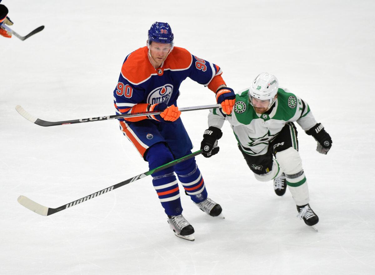 Corey Perry #90 of the Edmonton Oilers skates against Sam Steel #18 of the Dallas Stars during the first period of Game Four of the Western Conference Final of the 2024 Stanley Cup Playoffs at Rogers Place, in Edmonton, Alberta, Canada, on May 29, 2024. (Leila Devlin/Getty Images)