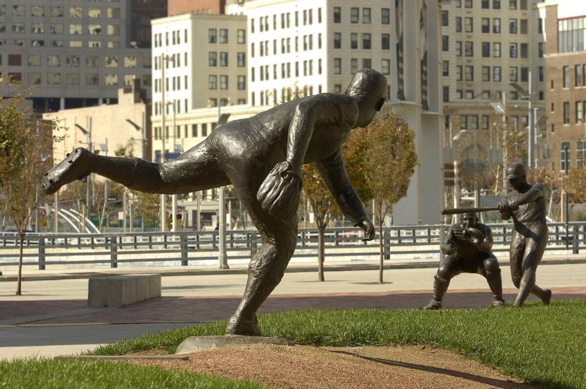 Statue of pitcher Joe Nuxhall, the youngest baseball player to ever play MLB, by Tom Tsuchiya, Great American Ball Park, Cincinnati. (<a href="https://commons.wikimedia.org/wiki/File:Reds_Legends_of_Crosley_Field_rev.jpg">NTT72USA/CC BY-SA 3.0</a>)