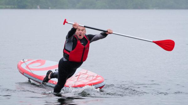 Liberal Democrat Leader Sir Ed Davey falls into the water while paddleboarding on Lake Windermere, Cumbria, England on May 28, 2024. (Peter Byrne/PA Wire)