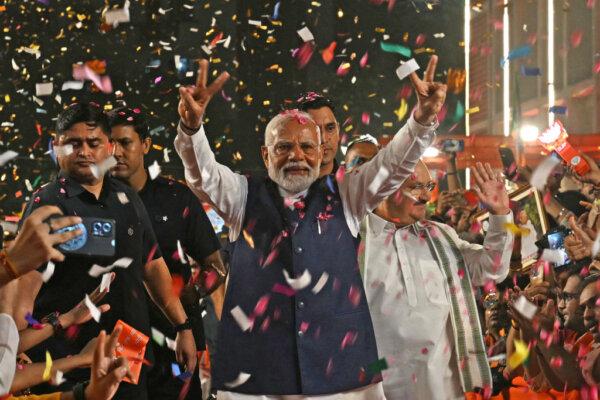 India's Prime Minister Narendra Modi flashes a victory sign as he arrives at Bharatiya Janata Party (BJP) headquarters to celebrate the party's win in the country's general election, in New Delhi, India, on June 4, 2024. (Arun Sankar/AFP via Getty Images)