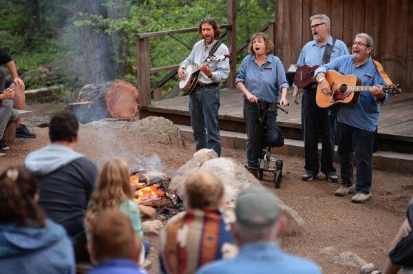 Members of the Sugar Pine Band perform during the midway break of a Yosemite Mountain Sugar Pine Railroad "moonlight special" excursion through the Sierra National Forest on June 6, 2019. (Craig Kohlruss/The Fresno Bee/TNS)