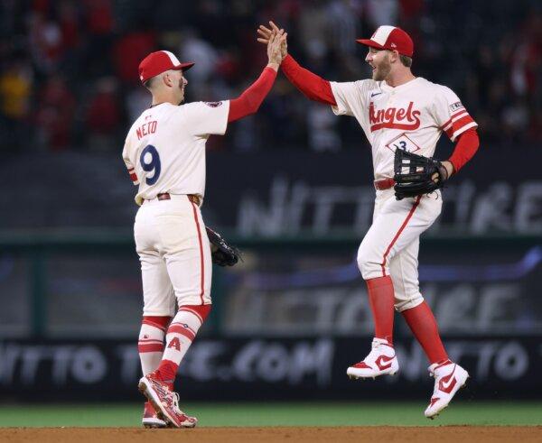 Zach Neto (9) and Taylor Ward (3) of the Los Angeles Angels celebrate a win over the San Diego Padres in Anaheim, Calif., on June 5, 2024. (Harry How/Getty Images)