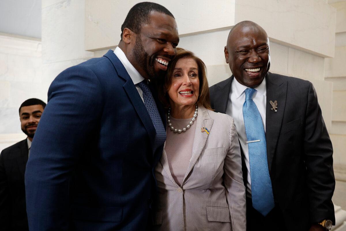 Recording artist Curtis "50 Cent" Jackson (L) and his lawyer Ben Crump pose for photographs with Rep. Nancy Pelosi (D-Calif.) while the two men are at the U.S. Capitol to advocate for black entrepreneurship in Washington on June 5, 2024. (Chip Somodevilla/Getty Images)