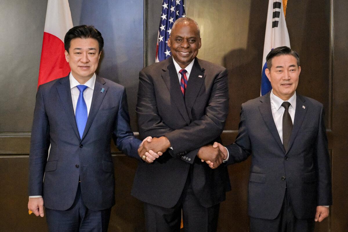 Japan's Defense Minister Minoru Kihara (L), U.S. Defense Secretary Lloyd Austin (C), and South Korea's Defense Minister Shin Won-sik (R) in Singapore on June 2, 2024. (Caroline Chia/AFP via Getty Images)