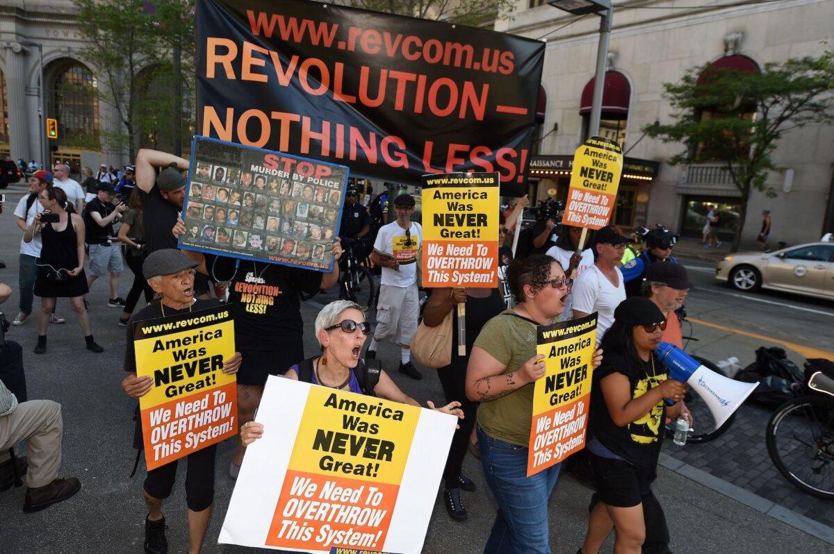 Anti-capitalism protestors march through the street near Freedom Plaza, July 20, 2016, in Cleveland, Ohio, on the third day of the Republican National Convention (RNC). (Robyn Beck/AFP via Getty Images)