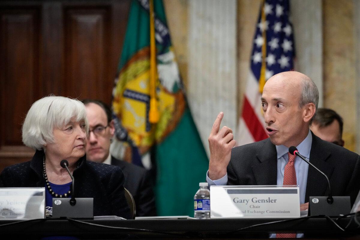 Treasury Secretary Janet Yellen looks on as Securities and Exchange Commission Chairman Gary Gensler speaks during a meeting of the Financial Stability Oversight Council at the Department of Treasury in Washington on Dec. 14, 2023. (Drew Angerer/Getty Images)