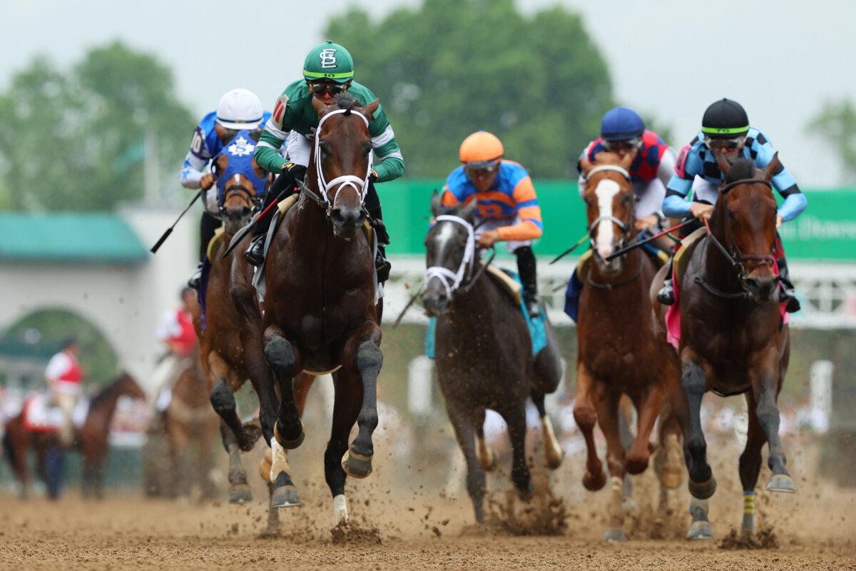 Mindframe, #11, with Irad Ortiz Jr. aboard, leads a undercard race to the first turn ahead of the 150th running of the Kentucky Derby at Churchill Downs, in Louisville, Kentucky, on May 4, 2024. (Michael Reaves/Getty Images)
