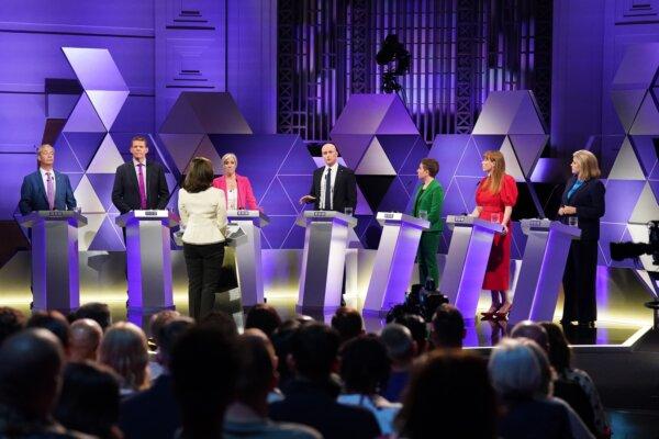 (L–R) Reform UK leader Nigel Farage, leader of Plaid Cymru Rhun ap Iorwerth, Liberal Democrat deputy leader Daisy Cooper, Stephen Flynn of the SNP, co-leader of the Green Party Carla Denyer, deputy Labour leader Angela Rayner and Commons Leader Penny Mordaunt, take part in the BBC Election Debate hosted by BBC news presenter Mishal Husain (front), at BBC Broadcasting House in London on June 7, 2024. (Stefan Rousseau/PA Wire)