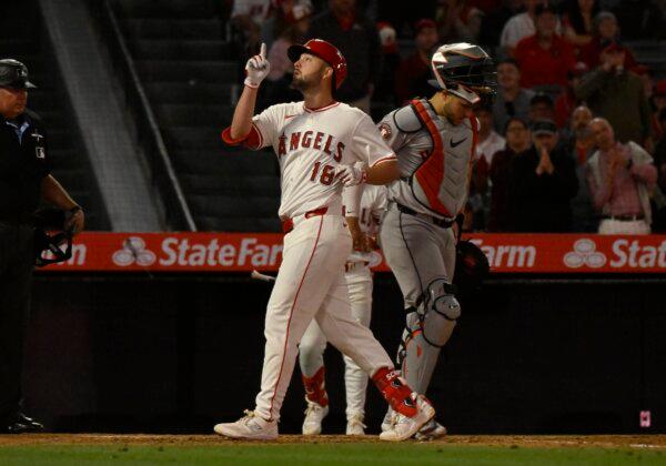 Nolan Schanuel (18) of the Los Angeles Angels points the sky after hitting a home run in the seventh inning as Yainer Diaz (21) of the Houston Astros looks down at the plate in Anaheim, Calif., on June 8, 2024. (John McCoy/Getty Images)