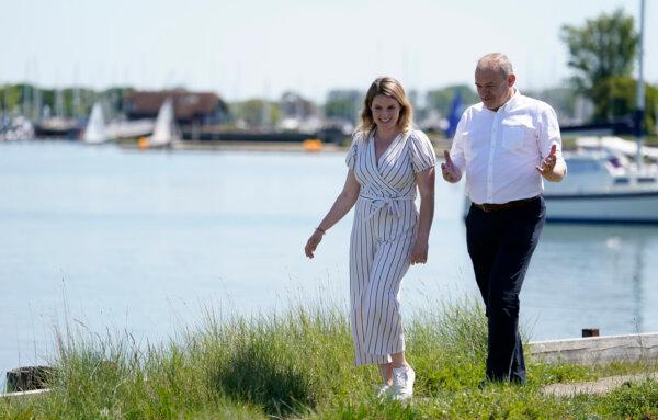 Liberal Democrat leader Sir Ed Davey walks with Liberal Democrat parliamentary candidate Jess Brown-Fuller during a visit to Birdham Pool Marina in Chichester, England on May 25, 2024. (Andrew Matthews/PA Wire)