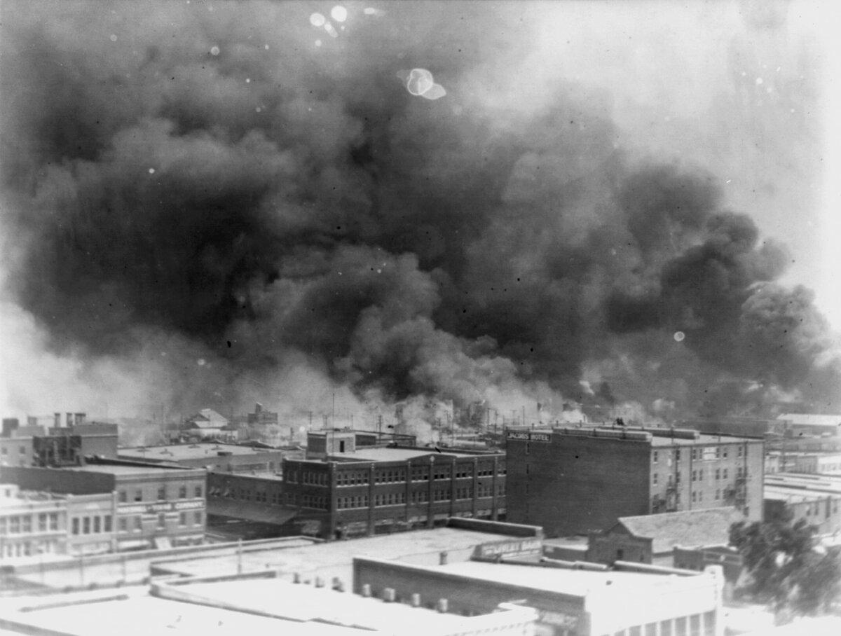 In this 1921 image provided by the Library of Congress, smoke billows over Tulsa, Okla., during the Tulsa Race Massacre. (Alvin C. Krupnick Co./Library of Congress via AP, File)