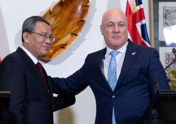 CCP Premier Li Qiang (L) and New Zealand's Prime Minister Christopher Luxon pose after attending a joint press conference at Government House in Wellington, New Zealand on June 13, 2024. (Marty Melville/AFP via Getty Images)