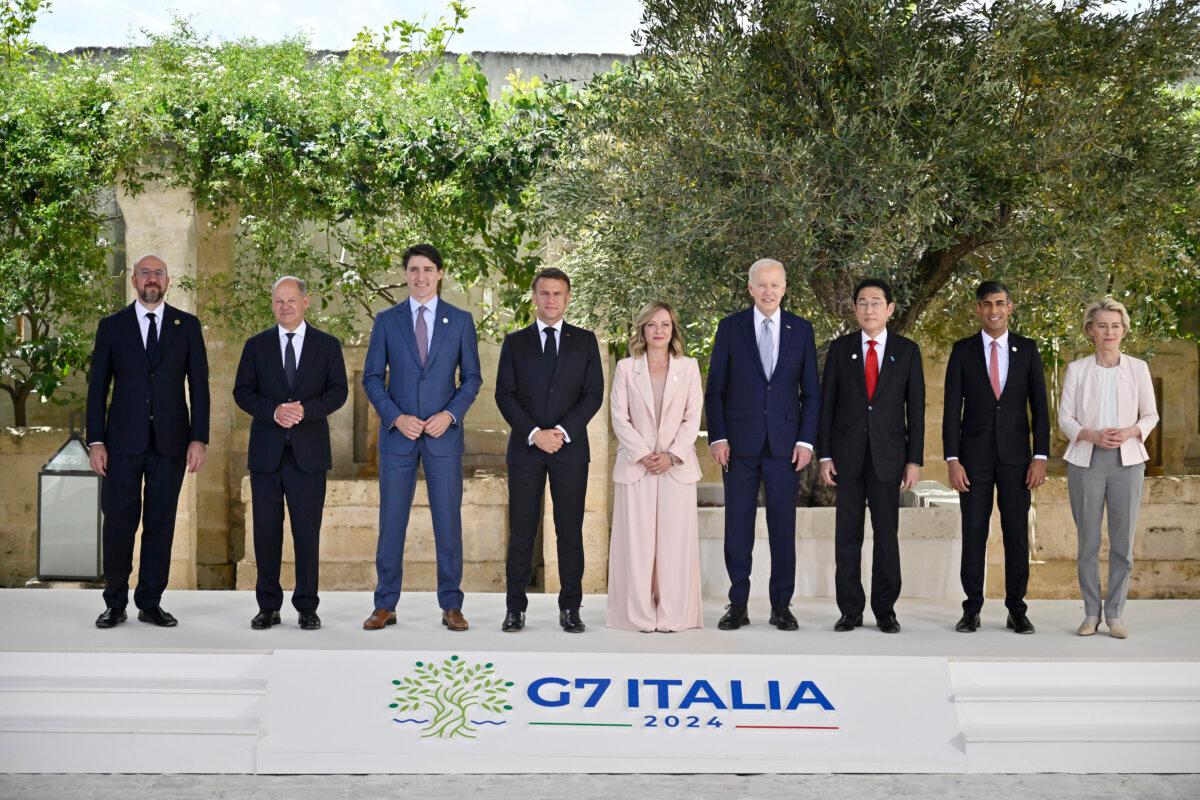 (LâR) European Council President Charles Michel, German Chancellor Olaf Scholz, Canadian Prime Minister Justin Trudeau, French President Emmanuel Macron, Italian Prime Minister Giorgia Meloni, U.S. President Joe Biden, Japanese Prime Minister Fumio Kishida, British Prime Minister Rishi Sunak and European Commission President Ursula von der Leyen pose for a family photo during a welcome ceremony on day one of the 50th G7 summit at Borgo Egnazia in Fasano, Italy, on June 13, 2024. (Antonio Masiello/Getty Images)